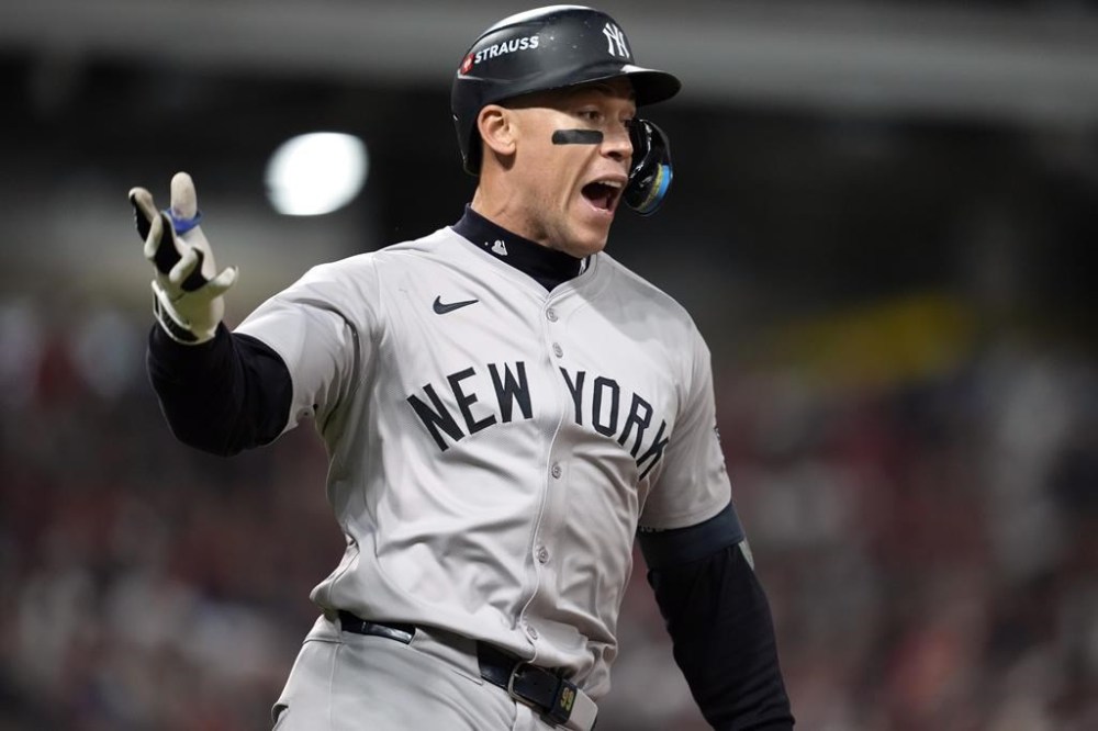 New York Yankees' Aaron Judge celebrates after hitting a two-run home run against the Cleveland Guardians during the eighth inning in Game 3 of the baseball AL Championship Series Thursday, Oct. 17, 2024, in Cleveland.(AP Photo/Godofredo Vásquez )