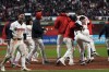 Cleveland Guardians players celebrate after David Fry's game-winning two-run home run against the New York Yankees during the 10th inning in Game 3 of the baseball AL Championship Series Thursday, Oct. 17, 2024, in Cleveland. The Guardians won 7-5. (AP Photo/Godofredo Vásquez )