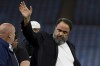 FILE - Evangelos Marinakis walks on the pitch at the end of the Europa Conference League semifinal, first leg, soccer match between Aston Villa and Olympiacos at Villa Park in Birmingham, England, Thursday, May 2, 2024. (AP Photo/Rui Vieira, File)