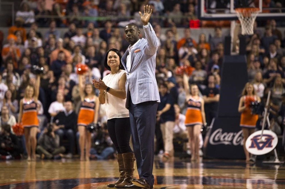 FILE - Allen Greene, Auburn Athletic Director, waives as his wife, Christy, and he are introduced during the first half of an NCAA college basketball game, Jan. 20, 2018, in Auburn, Ala. (AP Photo/Albert Cesare, File)
