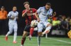 CF Montreal defender George Campbell (right) battles against Atlanta United midfielder Aleksey Miranchuk during the first half of an MLS soccer match on Oct. 2, in Atlanta. THE CANADIAN PRESS/AP, Atlanta Journal-Constitution, Miguel Martinez