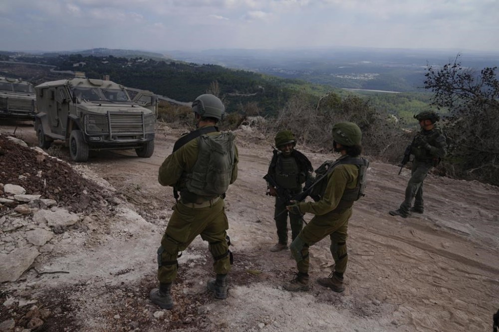 Israeli soldiers are seen during a ground operation in southern Lebanon, near the border with Israel, Sunday, Oct. 13, 2024. (AP Photo/Sam McNeil)