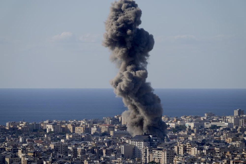 Smoke rises from an Israeli airstrike on Dahiyeh, in the southern suburb of Beirut, Lebanon, Saturday, Oct. 19, 2024. (AP Photo/Hussein Malla)