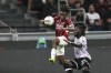 AC Milan's Samuel Chukwueze, left, and Udinese's Jordan Zemura challenge for the ball during the Serie A soccer match between AC Milan and Udinese at the San Siro Stadium, in Milan, Italy, Saturday, Oct. 19, 2024. (AP Photo/Antonio Calanni)