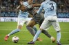 Real Madrid's Kylian Mbappe, centre, tries to get past Celta's Javier Manquillo, lef and Oscar Mingueza during a Spanish La Liga soccer match between Celta and Real Madrid at the Balaidos, stadium in Vigo, Spain, Saturday, Oct. 19, 2024. (AP Photo/Lalo R. Villar)