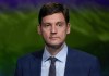 B.C. NDP Leader David Eby stands at a podium while waiting for the televised leaders' debate to begin, in Vancouver, on Tuesday, October 8, 2024. THE CANADIAN PRESS/Darryl Dyck