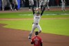 New York Yankees' Juan Soto celebrates after hitting a three-run home run against the Cleveland Guardians during the 10th inning in Game 5 of the baseball AL Championship Series Saturday, Oct. 19, 2024, in Cleveland. (AP Photo/Jeff Roberson)