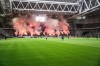 Djurgarden supporters set off pyrotechnics during the Allsvenskan soccer match between Hammarby IF and Djurgardens IF at Tele 2 Arena in Stockholm, Sweden on Sunday, Oct. 20, 2024. (Magnus Lejhall/TT News Agency via AP)