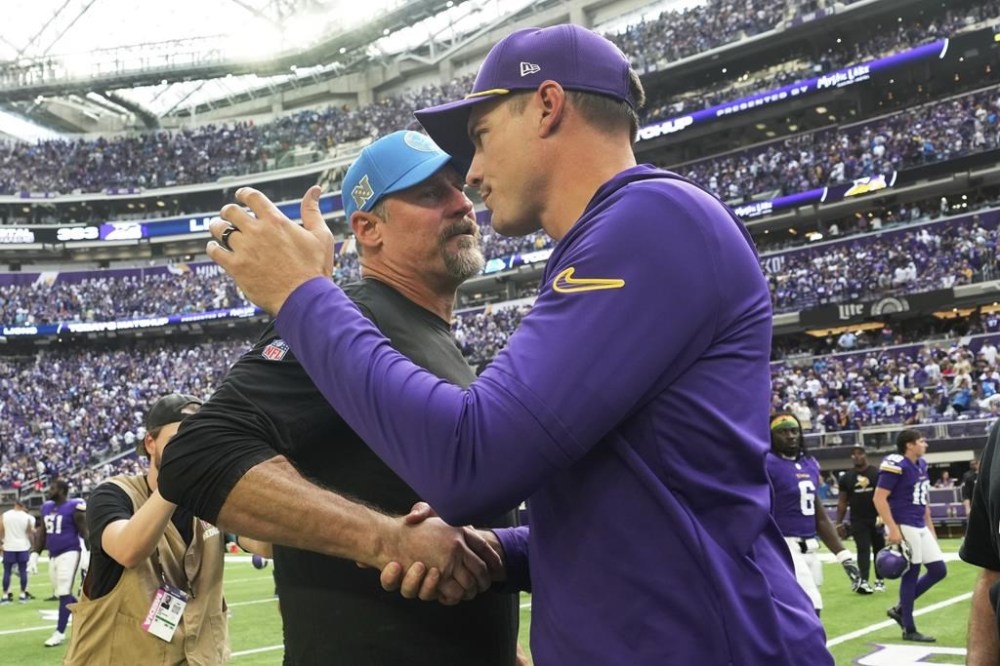 Detroit Lions head coach Dan Campbell, left, talks with Minnesota Vikings head coach Kevin O'Connell after an NFL football game Sunday, Oct. 20, 2024, in Minneapolis. (AP Photo/Abbie Parr)
