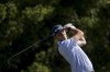 J.T. Poston hits off the tee on the third hole during the final round of the Shriners Children's Open golf tournament, Sunday, Oct. 20, 2024, in Las Vegas. (AP Photo/Ian Maule)