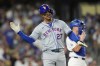 New York Mets' Mark Vientos celebrates a two-run home run during fourth inning of Game 6 in a baseball NL Championship Series against the Los Angeles Dodgers, Sunday, Oct. 20, 2024, in Los Angeles. (AP Photo/Julio Cortez)