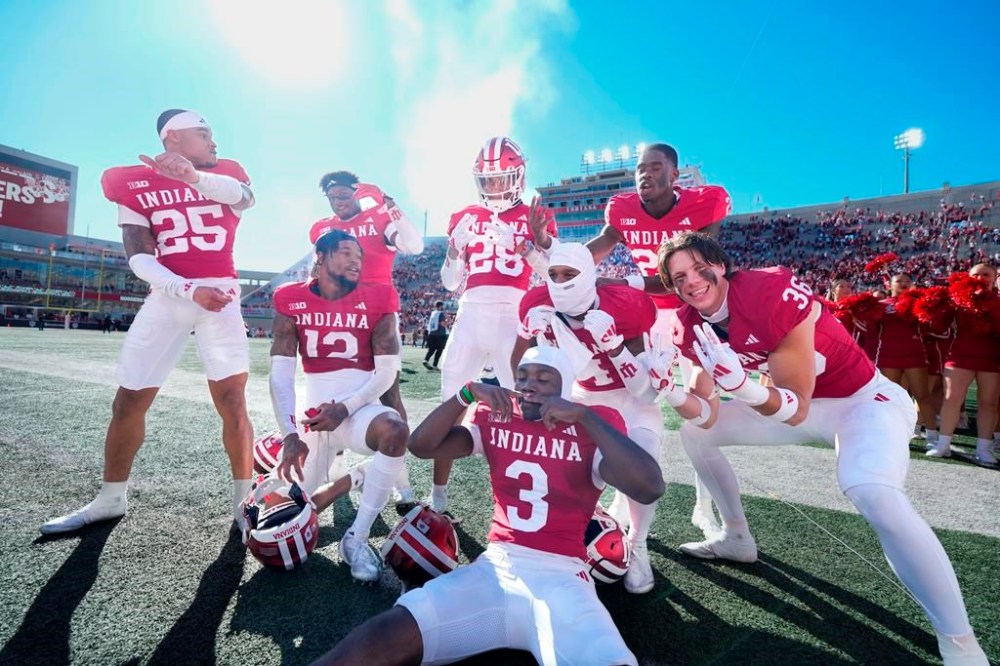 Indiana teammates celebrate after defeating Nebraska in an NCAA college football game in Bloomington, Ind., Saturday, Oct. 19, 2024. (AP Photo/AJ Mast)