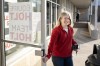 New Brunswick Liberal Party Leader Susan Holt holds the door for volunteers leaving her headquarters to knock on doors in her riding in Fredericton, Saturday, Oct. 19, 2024. THE CANADIAN PRESS/Darren Calabrese