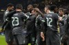 AC Milan's Christian Pulisic, center, celebrates with teammates after scoring his side's first goal during the Champions League opening phase soccer match between AC Milan and Club Brugge at the San Siro stadium in Milan, Italy, Tuesday, Oct. 22, 2024. (AP Photo/Antonio Calani)