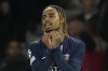 PSG's Bradley Barcola reacts during the Champions League opening phase soccer match between Paris Saint-Germain and PSV Eindhoven at the Parc des Princes stadium in Paris, France, Tuesday, Oct. 22, 2024. (AP Photo/Christophe Ena)