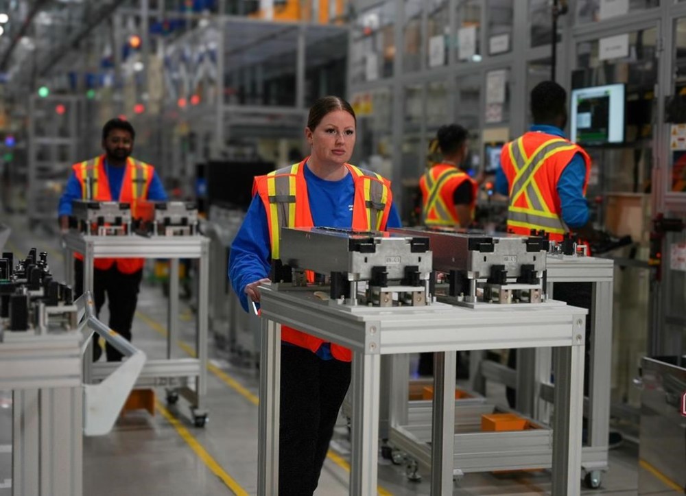 A NextStar Energy employee moves completed battery modules at their plant in Windsor, Ont., in an undated handout photo. THE CANADIAN PRESS/HO-NextStar, *MANDATORY CREDIT*