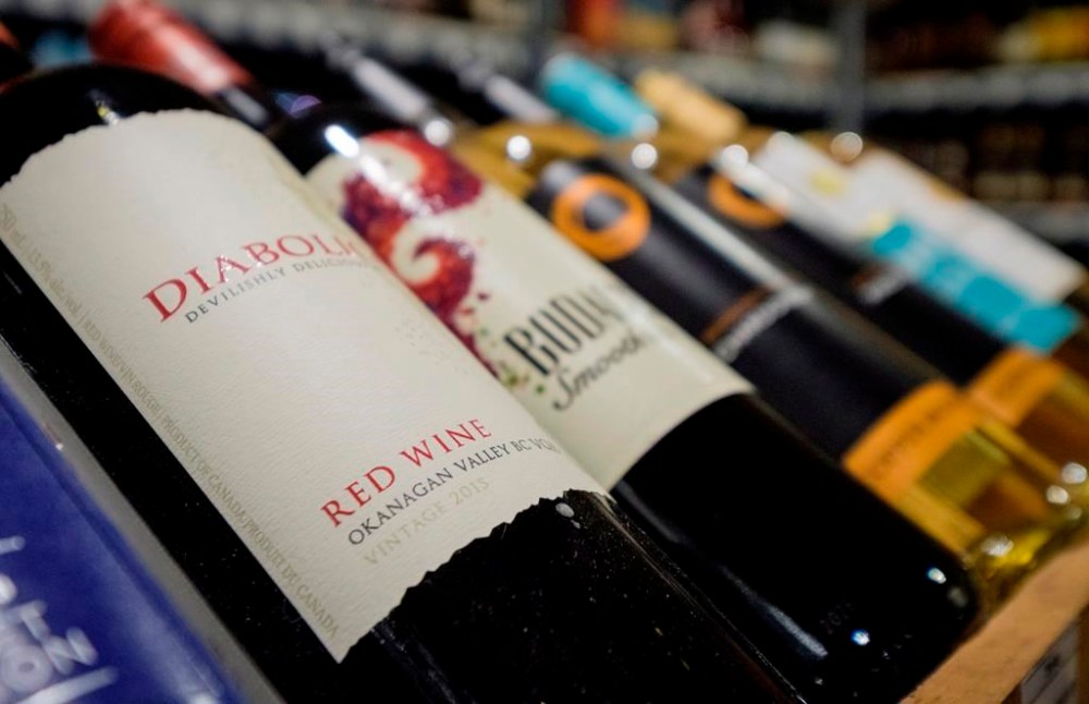 The Manitoba government is looking to add more liquor outlets inside food and grocery stores. Bottles of wine are on display at a liquor store in Cremona, Alta., Wednesday, Feb. 7, 2018. THE CANADIAN PRESS/Jeff McIntosh