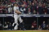 New York Yankees' Giancarlo Stanton watches his two-run home run against the Cleveland Guardians during the sixth inning in Game 5 of the baseball AL Championship Series Saturday, Oct. 19, 2024, in Cleveland. (AP Photo/Godofredo A. Vásquez)