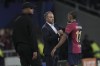 Barcelona's head coach Hansi Flick greets Barcelona's Raphinha as he is substituted during the Champions League opening phase soccer match between Barcelona and Bayern Munich at the Lluis Companys Olympic Stadium in Barcelona, Spain, Wednesday, Oct. 23, 2024. (AP Photo/Emilio Morenatti)