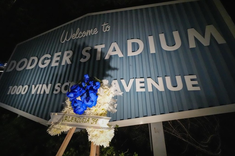 A flower arrangement honoring former Los Angeles Dodgers pitcher Fernando Valenzuela is seen near the entrance to Dodger Stadium, Tuesday, Oct. 22, 2024 in Los Angeles. Valenzuela, the Mexican-born phenom for the Los Angeles Dodgers who inspired