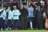 Arsenal's manager Mikel Arteta gives instructions from the side line as Arsenal's William Saliba, centre right, leaves the pitch after receiving the red card during the English Premier League soccer match between Bournemouth and Arsenal at the Vitality Stadium in Bournemouth, England, Saturday, Oct. 19, 2024. (AP Photo/Kin Cheung)