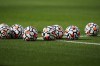 Balls sit on the pitch before an English Premier League soccer match between West Ham United and Brentford at London Stadium in London, on Oct. 3, 2021. (AP Photo/Steve Luciano)