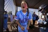 Michaela Beachy from the Ball Girls Blue team, celebrates in the dugout during the Leighton Accardo Invitational game against the California Wave at Pima Park East, on Sunday, Dec. 11, 2022 in Chandler, Ariz. (Jean Fruth via AP)
