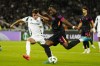 Chelsea's Axel Disai, right, challenges for the ball with Panathinaikos' Georgios Vagiannidis during the Europa Conference League opening phase soccer match between Panathinaikos and Chelsea at the Olympic stadium in Athens, Greece, Thursday, Oct. 24, 2024. (AP Photo/Petros Giannakouris)