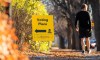 A pedestrian walks past a sign outside a voting place for the Saskatchewan general election in Regina, on Thursday, October 24, 2024. THE CANADIAN PRESS/Heywood Yu