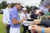 Collin Morikawa, the defending Zozo champion, signs autographs after his second round of the PGA Tour Zozo Championship at the Narashino Country Club in Inzai on the outskirts of Tokyo, Friday, Oct. 25, 2024. (AP Photo/Stephen Wade)