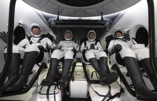This photo provided by NASA shows Roscosmos cosmonaut Alexander Grebenkin, left, NASA astronauts Michael Barratt, second from left, Matthew Dominick, second from right, and Jeanette Epps, right, inside the SpaceX Dragon Endeavour spacecraft onboard the SpaceX recovery ship MEGAN shortly after having landed in the Gulf of Mexico off the coast of Pensacola, Florida, Friday, Oct. 25, 2024. (NASA/Joel Kowsky via AP)