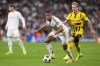 Real Madrid's Kylian Mbappe plays the ball during the Champions League opening phase soccer match between Real Madrid and Borussia Dortmund at the Santiago Bernabeu stadium in Madrid, Tuesday, Oct. 22, 2024. Real Madrid won 5-2. (AP Photo/Manu Fernandez)