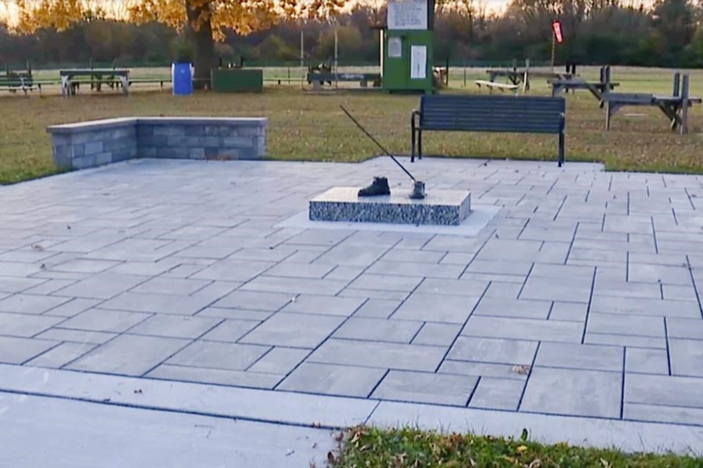 In this image taken from a video provided by WXYZ, only the feet are left of a 600-pound bronze statue of a Tuskegee airman after it was stolen from a city park in Detroit on Friday, October 24, 2024. (WXYZ via AP)