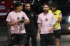 Inter Miami forwards Luis Suárez, left and Lionel Messi arrive for match one of their MLS playoff opening round soccer match against Atlanta United, Friday, Oct. 25, 2024, in Fort Lauderdale, Fla. (AP Photo/Lynne Sladky)