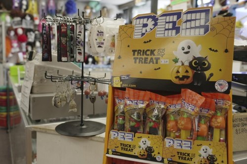 Candy and Halloween trinkets sit on the counter at a store in Chicago on Oct. 8, 2024. (AP Photo/Laura Bargfeld)