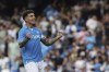 Napoli's Giovanni Di Lorenzo celebrates after scoring the opening goal during the Serie A soccer match between Napoli and Lecce at the Diego Armando Maradona Stadium in Naples, Italy, Saturday, Oct. 26, 2024. (Alessandro Garofalo/LaPresse via AP)