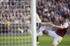 Manchester United's Diogo Dalot, left, misses an opportunity on goal during the English Premier League soccer match between West Ham United and Manchester United at the London Stadium in London, Sunday, Oct. 27, 2024. (John Walton/PA via AP)