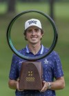 Nico Echavarria of Colombia poses with the trophy after winning the PGA Tour Zozo Championship at the Narashino Country Club in Inzai on the outskirts of Tokyo, Sunday, Oct. 27, 2024. (AP Photo/Tomohiro Ohsumi)