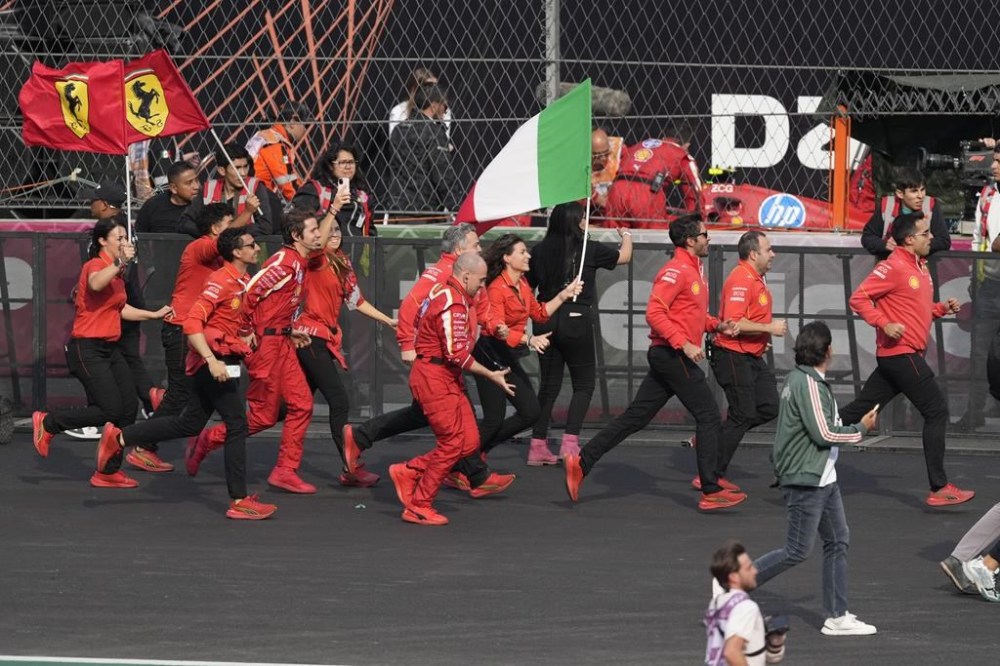 Ferrari team members celebrate after Carlos Sainz of Spain won the Formula One Mexico Grand Prix auto race at the Hermanos Rodriguez racetrack in Mexico City, Sunday, Oct. 27, 2024. (AP Photo/Eduardo Verdugo)