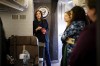 Democratic presidential nominee Vice President Kamala Harris eats Doritos and thanks senior staff aboard Air Force Two in Philadelphia, Sunday, Oct. 27, 2024. (Erin Schaff//The New York Times via AP, Pool)