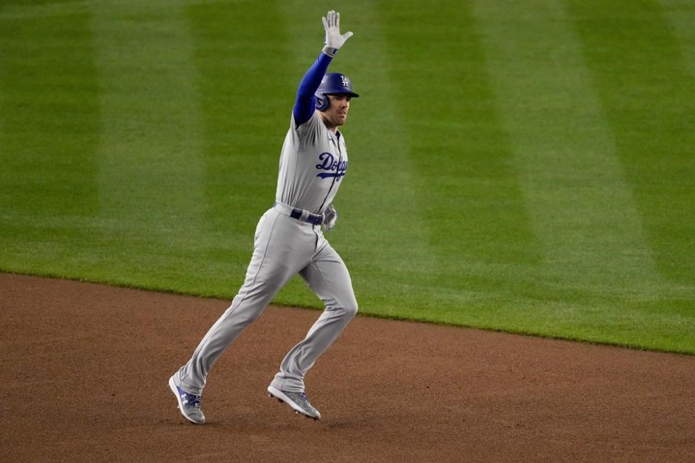 Los Angeles Dodgers' Freddie Freeman celebrates a two-run home run against the New York Yankees during the first inning in Game 3 of the baseball World Series, Monday, Oct. 28, 2024, in New York. (AP Photo/Frank Franklin II)