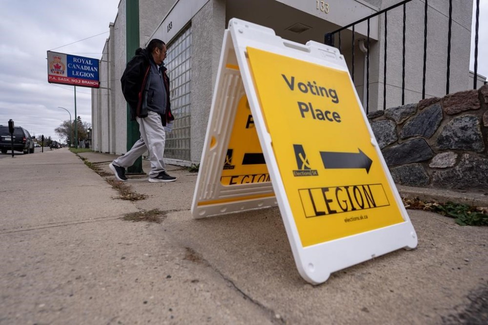People enter a polling station to vote on provincial election day in Prince Albert, Sask. on Monday, Oct. 28, 2024. THE CANADIAN PRESS/Liam Richards