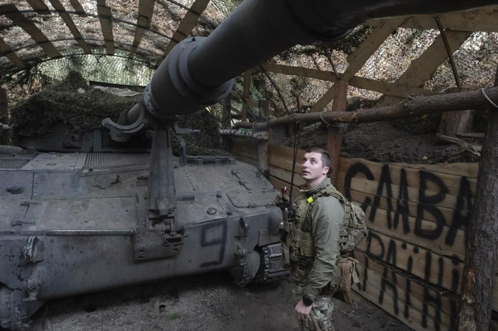 Ukrainian officer of the 92nd separate assault brigade inspects 155mm M-109