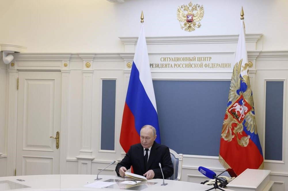Russian President Vladimir Putin takes part in an exercise of Russia's strategic nuclear deterrence forces to train actions of officials on operating nuclear weapons with practical launches of ballistic and cruise missiles, at the Kremlin in Moscow, Russia, Tuesday, Oct. 29, 2024. (Mikhail Metzel, Sputnik, Kremlin Pool Photo via AP)