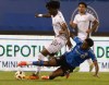 Forge FC midfielder Kwasi Poku (20) drives the ball as CF Montreal midfielder Rida Zouhir (18) defends during second half Canadian Championship quarterfinal soccer action in Montreal, Wednesday, May 22, 2024. THE CANADIAN PRESS/Christinne Muschi