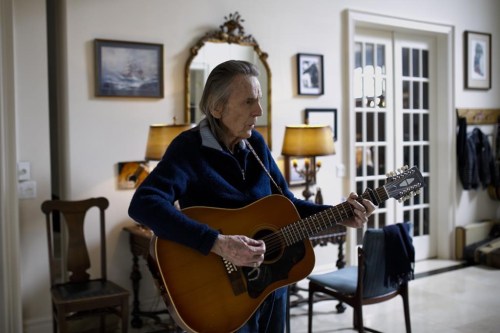 Canadian musician Gordon Lightfoot strums his guitar in his Toronto home on Thursday, April 25, 2019. THE CANADIAN PRESS/Cole Burston