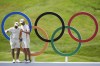 Matthieu Pavon, left, and Victor Perez, of France, pose with the Olympic rings after a practice round for the men's golf event at the 2024 Summer Olympics, Wednesday, July 31, 2024, at Le Golf National in Saint-Quentin-en-Yvelines, France. (AP Photo/George Walker IV)