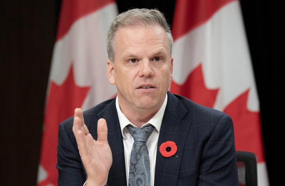 Health Minister Mark Holland speaks during a news conference, in Ottawa, Tuesday, Oct. 29, 2024. Health Minister Mark Holland provided an update on the Silk and Great Value plant-based beverages Listeria investigation on Tuesday. THE CANADIAN PRESS/Adrian Wyld