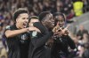 Sheffield's Djeidi Gassama, center, celebrates scoring their side's first goal against Brentford during a League Cup fourth round soccer match at the Gtech Community Stadium in London, Tuesday, Oct. 29, 2024. (John Walton/PA via AP)