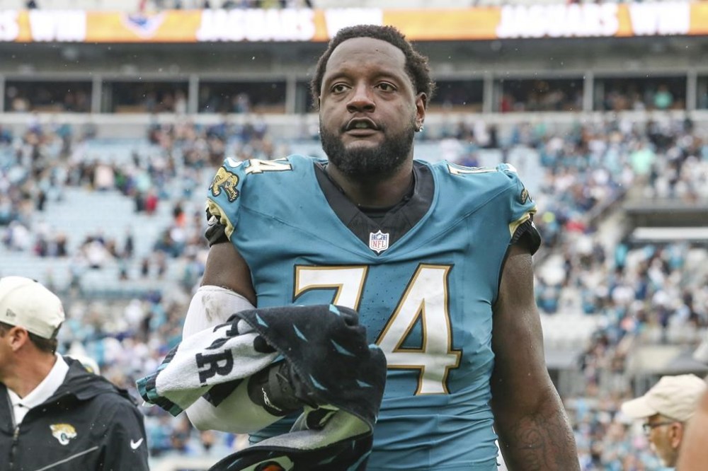 FILE -Jacksonville Jaguars offensive tackle Cam Robinson (74) leaves the field after an NFL football game against the Indianapolis Colts, Sunday, Oct. 6, 2024, in Jacksonville, Fla. (AP Photo/Gary McCullough, File)